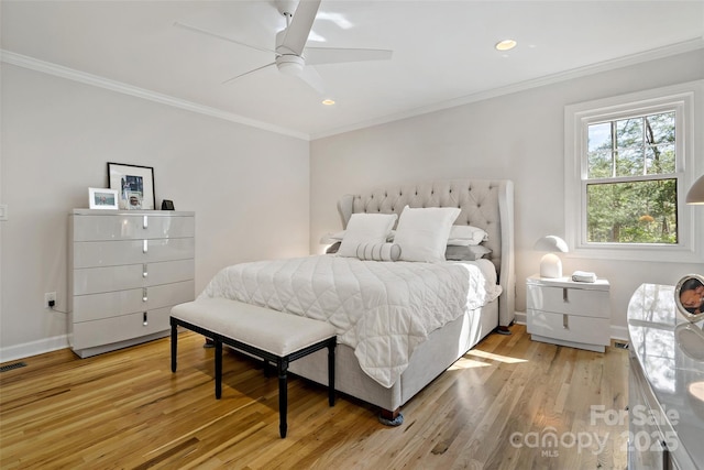 bedroom featuring ceiling fan, light wood finished floors, recessed lighting, baseboards, and ornamental molding