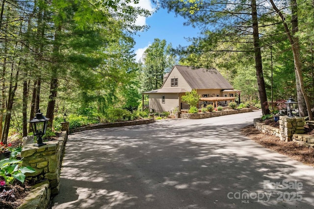 view of side of home with driveway