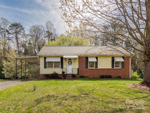12 Birchwood Ln, Asheville, NC 28805 - single story home featuring a front yard, brick siding, a carport, and driveway