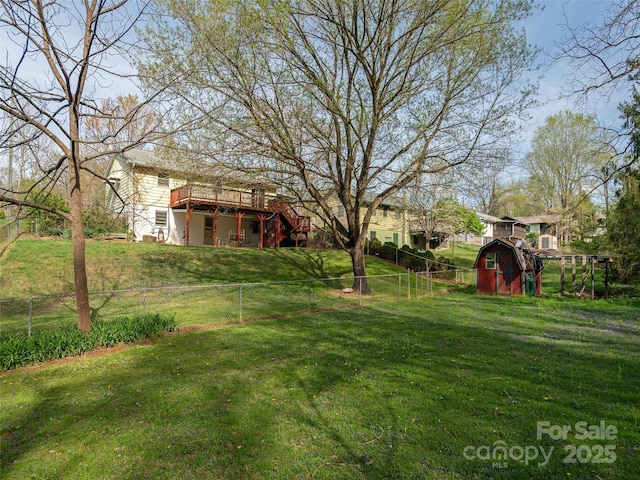 12 Birchwood Ln, Asheville, NC 28805 - view of yard with a deck, a fenced backyard, stairway, a storage unit, and an outbuilding
