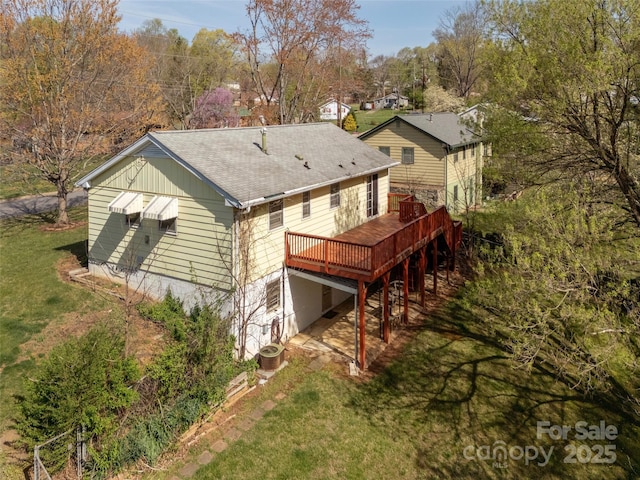 12 Birchwood Ln, Asheville, NC 28805 - back of house featuring a shingled roof, a deck, and a lawn