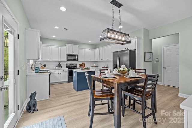 1809 Robbins Meadows Dr, Waxhaw, NC 28173 - dining space featuring light wood-type flooring and recessed lighting