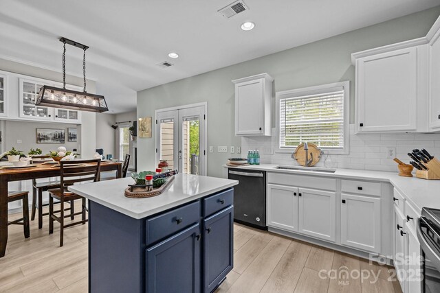 1809 Robbins Meadows Dr, Waxhaw, NC 28173 - kitchen with dishwashing machine, blue cabinets, white cabinetry, light countertops, and recessed lighting