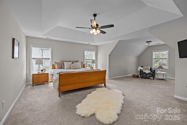 1809 Robbins Meadows Dr, Waxhaw, NC 28173 - bedroom with light colored carpet, a tray ceiling, and a ceiling fan