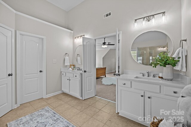 1809 Robbins Meadows Dr, Waxhaw, NC 28173 - full bath with a ceiling fan, two vanities, and tile patterned floors