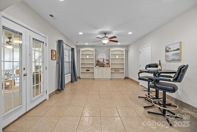 1809 Robbins Meadows Dr, Waxhaw, NC 28173 - living area with french doors, recessed lighting, ceiling fan, and light tile patterned floors