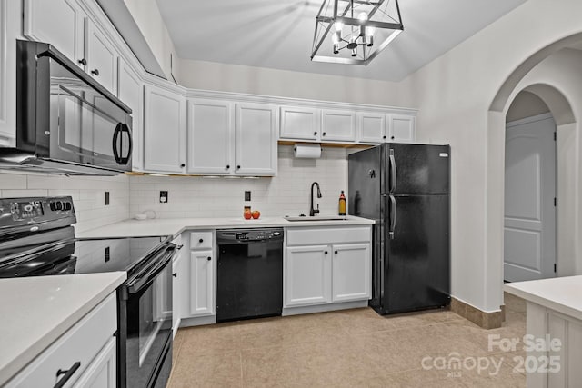 1809 Robbins Meadows Dr, Waxhaw, NC 28173 - kitchen with black appliances, white cabinets, backsplash, light countertops, and light tile patterned floors