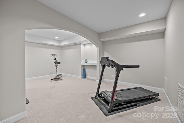 1809 Robbins Meadows Dr, Waxhaw, NC 28173 - workout area with carpet floors, arched walkways, and recessed lighting