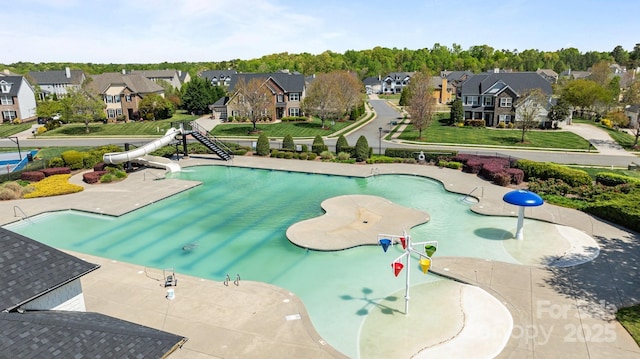 1809 Robbins Meadows Dr, Waxhaw, NC 28173 - view of swimming pool featuring a water slide and a residential view
