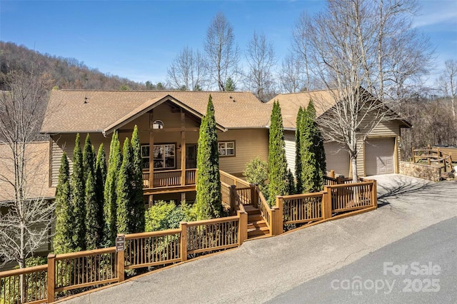 226 Sawgrass Dr Unit 3, Whittier, NC 28789 - view of front of house with concrete driveway, a garage, and a shingled roof