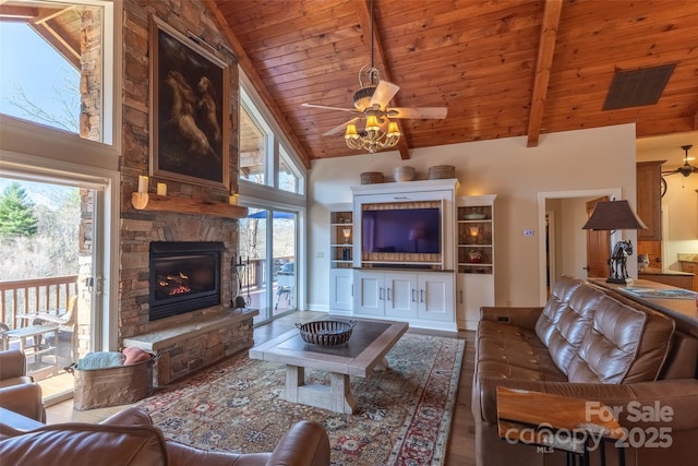 226 Sawgrass Dr Unit 3, Whittier, NC 28789 - living area with a stone fireplace, a ceiling fan, beamed ceiling, high vaulted ceiling, and wood ceiling