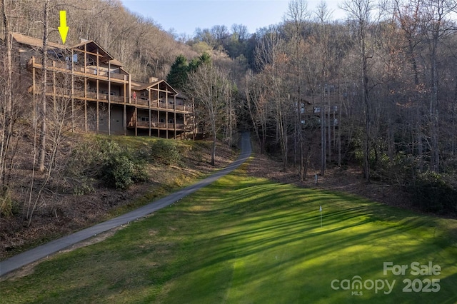 226 Sawgrass Dr Unit 3, Whittier, NC 28789 - exterior space featuring a wooded view, a yard, and a deck