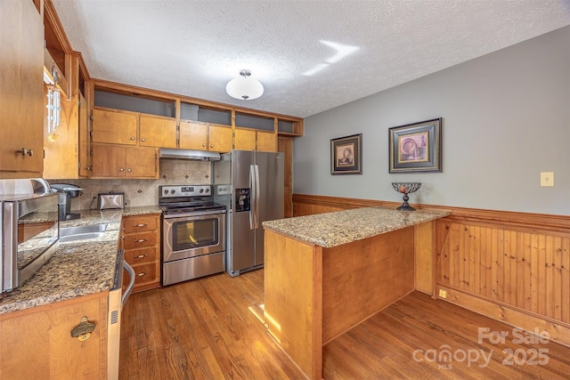 207 New Orleans Blvd, Morganton, NC 28655 - kitchen featuring under cabinet range hood, stainless steel appliances, open shelves, a peninsula, and a textured ceiling
