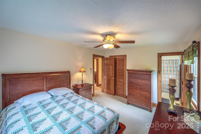 207 New Orleans Blvd, Morganton, NC 28655 - bedroom featuring a ceiling fan, carpet flooring, a textured ceiling, and a closet