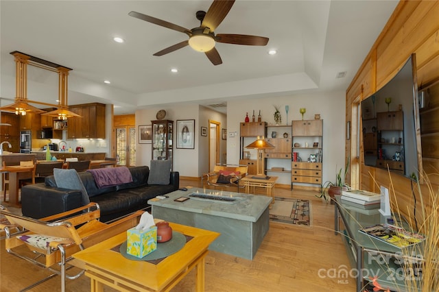 263 Mine Cove Rd, Spruce Pine, NC 28777 - living area featuring a raised ceiling, ceiling fan, recessed lighting, and light wood-style flooring