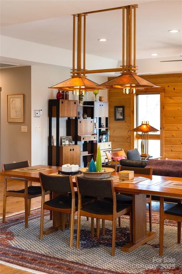 263 Mine Cove Rd, Spruce Pine, NC 28777 - dining space with recessed lighting, wood walls, and wood finished floors