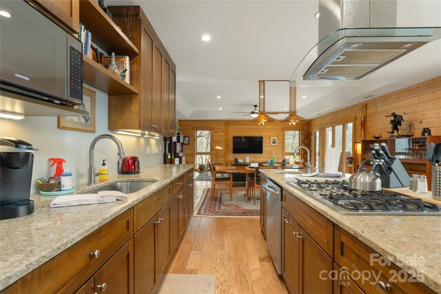 263 Mine Cove Rd, Spruce Pine, NC 28777 - kitchen featuring stainless steel appliances, plenty of natural light, wooden walls, and a sink