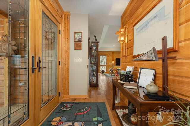 263 Mine Cove Rd, Spruce Pine, NC 28777 - entrance foyer featuring wooden walls, wood finished floors, french doors, and baseboards