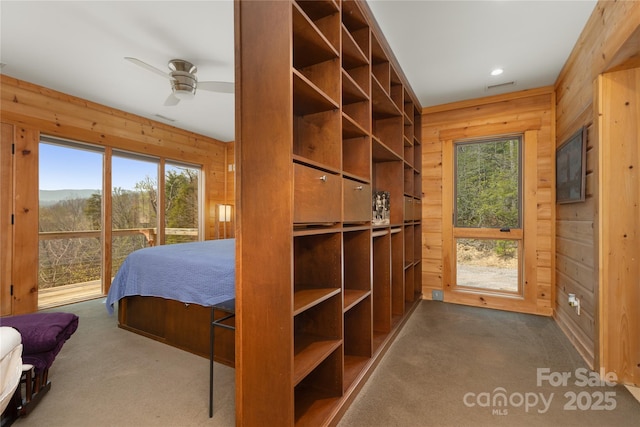 263 Mine Cove Rd, Spruce Pine, NC 28777 - carpeted bedroom with visible vents, wooden walls, and recessed lighting