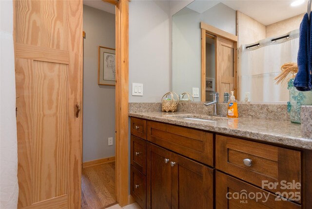 263 Mine Cove Rd, Spruce Pine, NC 28777 - bathroom with wood finished floors and vanity