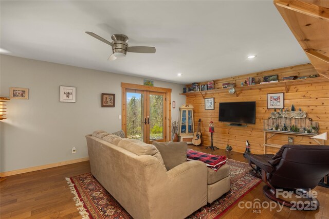 263 Mine Cove Rd, Spruce Pine, NC 28777 - living area featuring recessed lighting, wooden walls, a ceiling fan, french doors, and wood finished floors