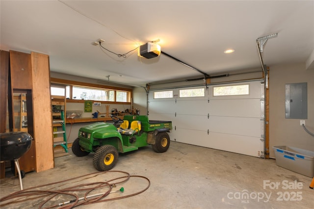 263 Mine Cove Rd, Spruce Pine, NC 28777 - garage featuring a garage door opener, recessed lighting, and electric panel