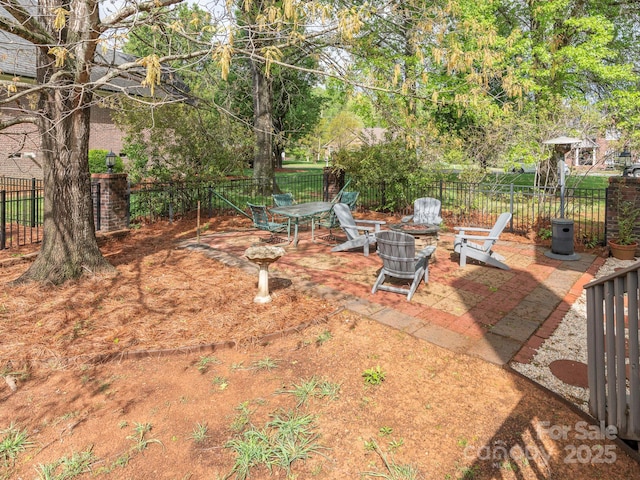 view of yard featuring a patio and a fenced backyard