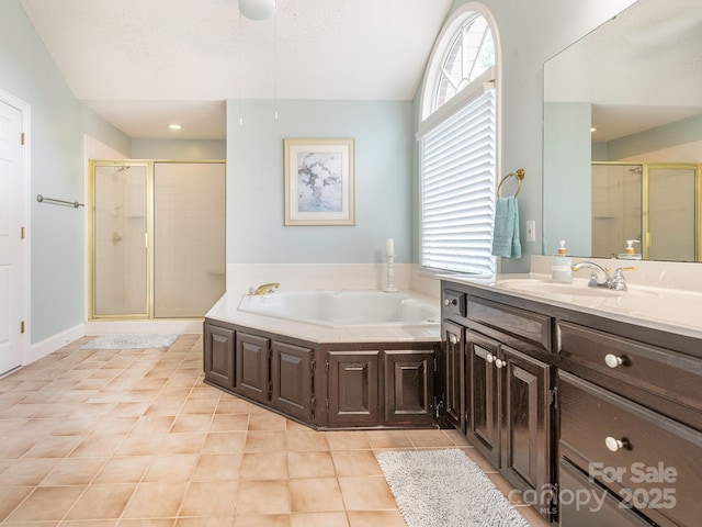 bathroom featuring vanity, a shower stall, tile patterned flooring, and a garden tub