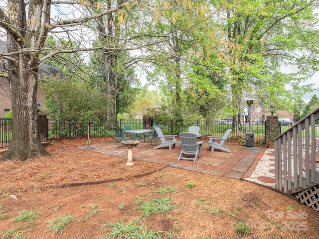 view of yard featuring a patio and a fenced backyard