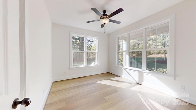 472 Bellingshire Dr, Mount Ulla, NC 28125 - empty room with light wood-style flooring, a ceiling fan, and baseboards
