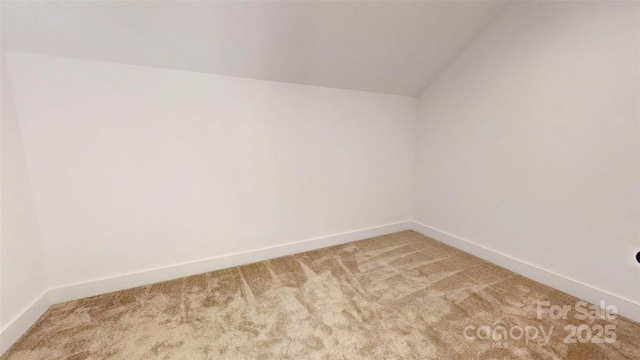 472 Bellingshire Dr, Mount Ulla, NC 28125 - spare room featuring light colored carpet, baseboards, and lofted ceiling