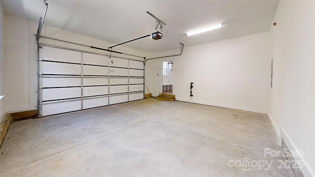 472 Bellingshire Dr, Mount Ulla, NC 28125 - garage featuring baseboards and a garage door opener