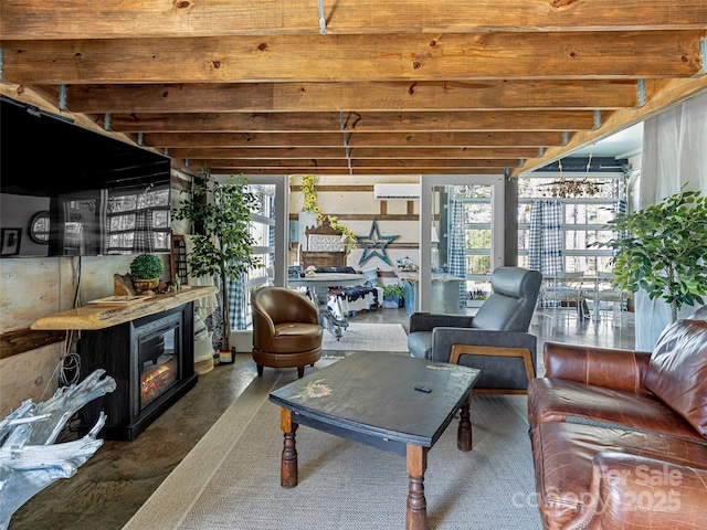 sunroom featuring a wall mounted AC