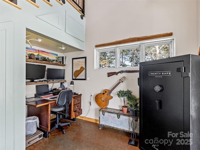 office space featuring a towering ceiling