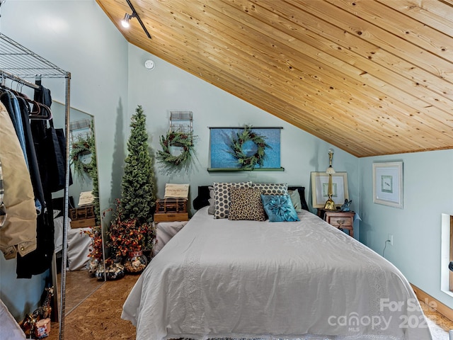 bedroom featuring wood ceiling and lofted ceiling