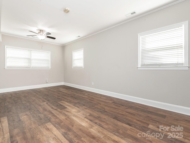 unfurnished room featuring ceiling fan, ornamental molding, visible vents, baseboards, and dark wood-style floors