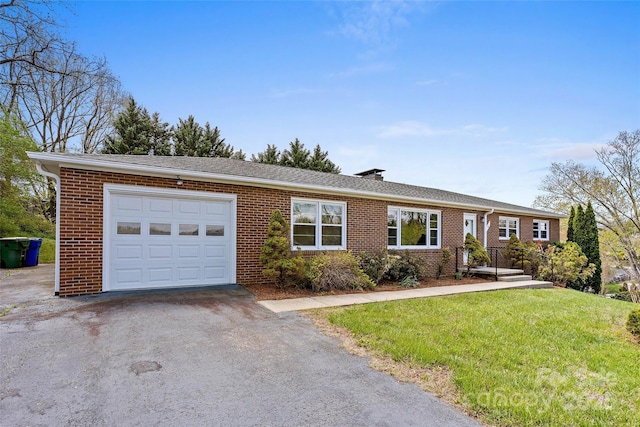 single story home featuring aphalt driveway, a front lawn, brick siding, an attached garage, and a chimney