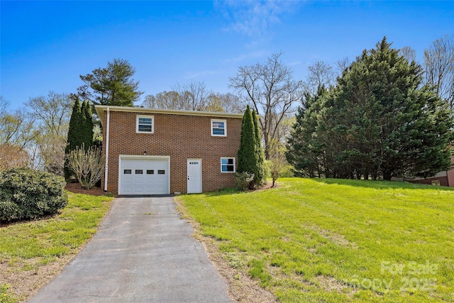 view of home's exterior with brick siding, an attached garage, a lawn, and driveway