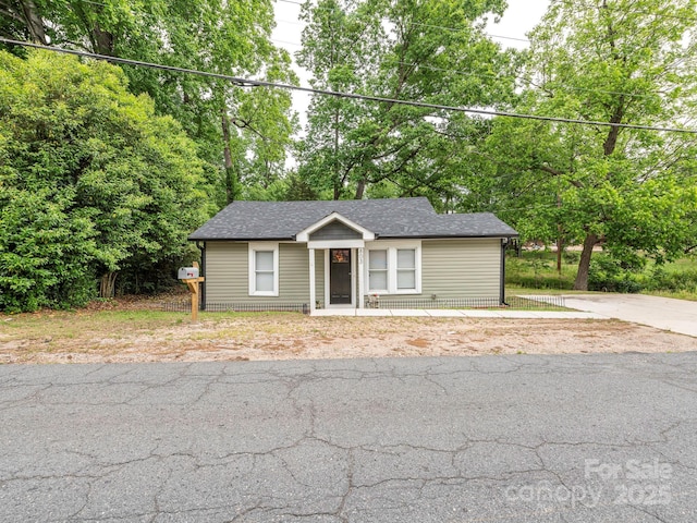 view of front of property with roof with shingles