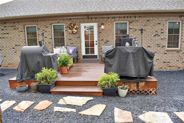 deck featuring a grill