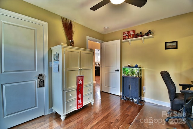 office with wood finished floors, a ceiling fan, and baseboards