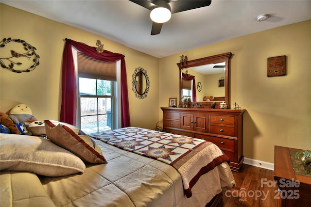 bedroom featuring dark wood-style flooring, baseboards, and a ceiling fan