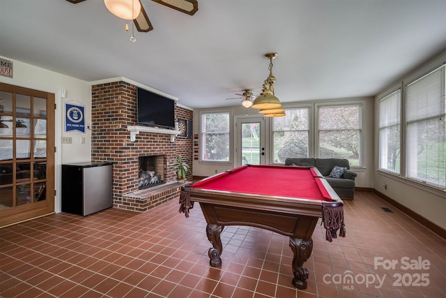 game room with tile patterned floors, a fireplace, a ceiling fan, and pool table