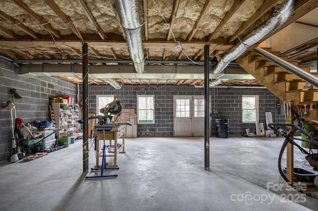 basement featuring stairs