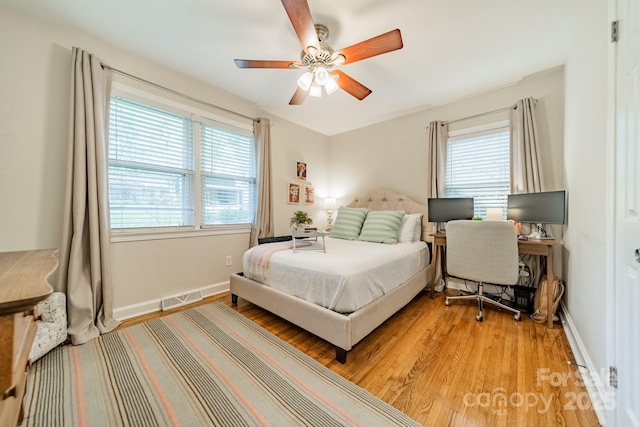 3510 Conway Ave, Charlotte, NC 28209 - bedroom with light wood finished floors, ceiling fan, and baseboards