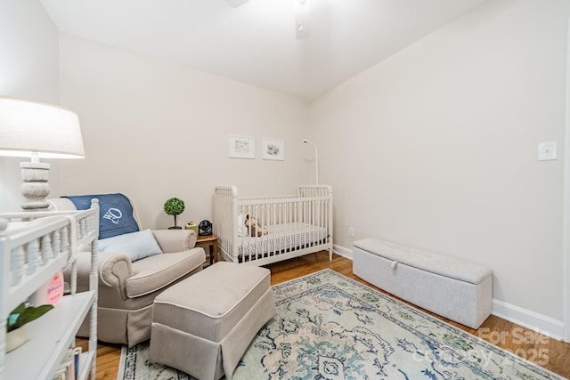 3510 Conway Ave, Charlotte, NC 28209 - bedroom featuring baseboards, wood finished floors, and a ceiling fan