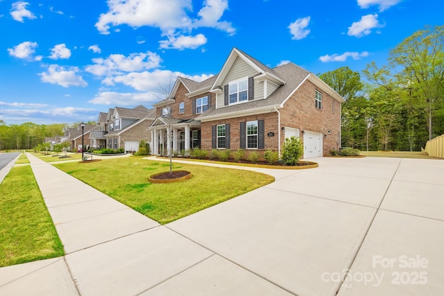view of front of home with a residential view, driveway, an attached garage, a front yard, and brick siding