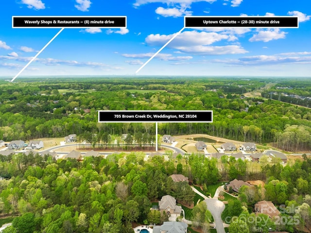aerial view featuring a forest view