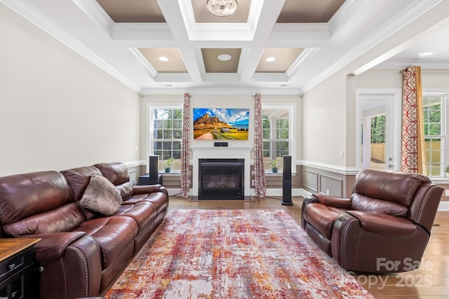 living room featuring crown molding, beam ceiling, coffered ceiling, and wood finished floors