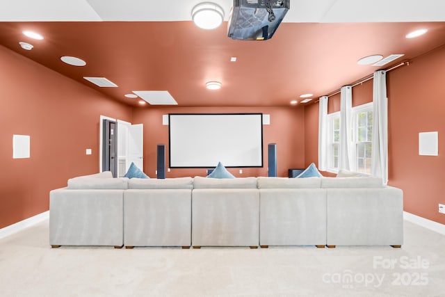 home theater featuring light colored carpet, baseboards, and recessed lighting